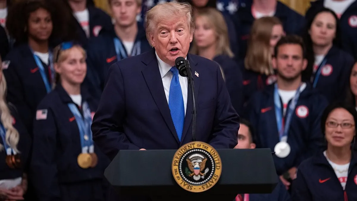 President Donald Trump speaking to Team USA athletes inside the White House East Room.