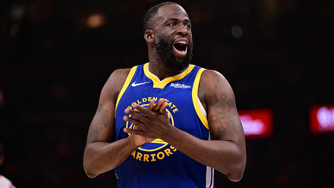 Draymond Green playing defense for Golden State Warriors in NBA game