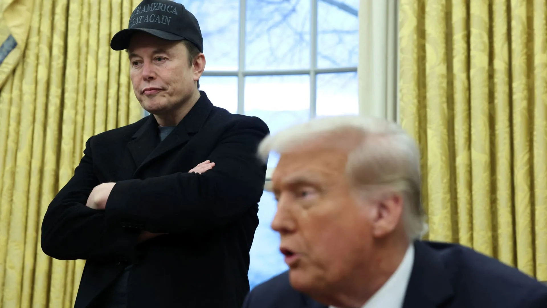 GAO report document with DOGE website and Elon Musk photo