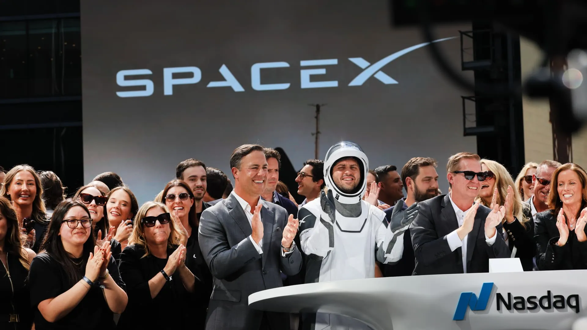 SpaceX rocket launch with stock chart overlay and trading data